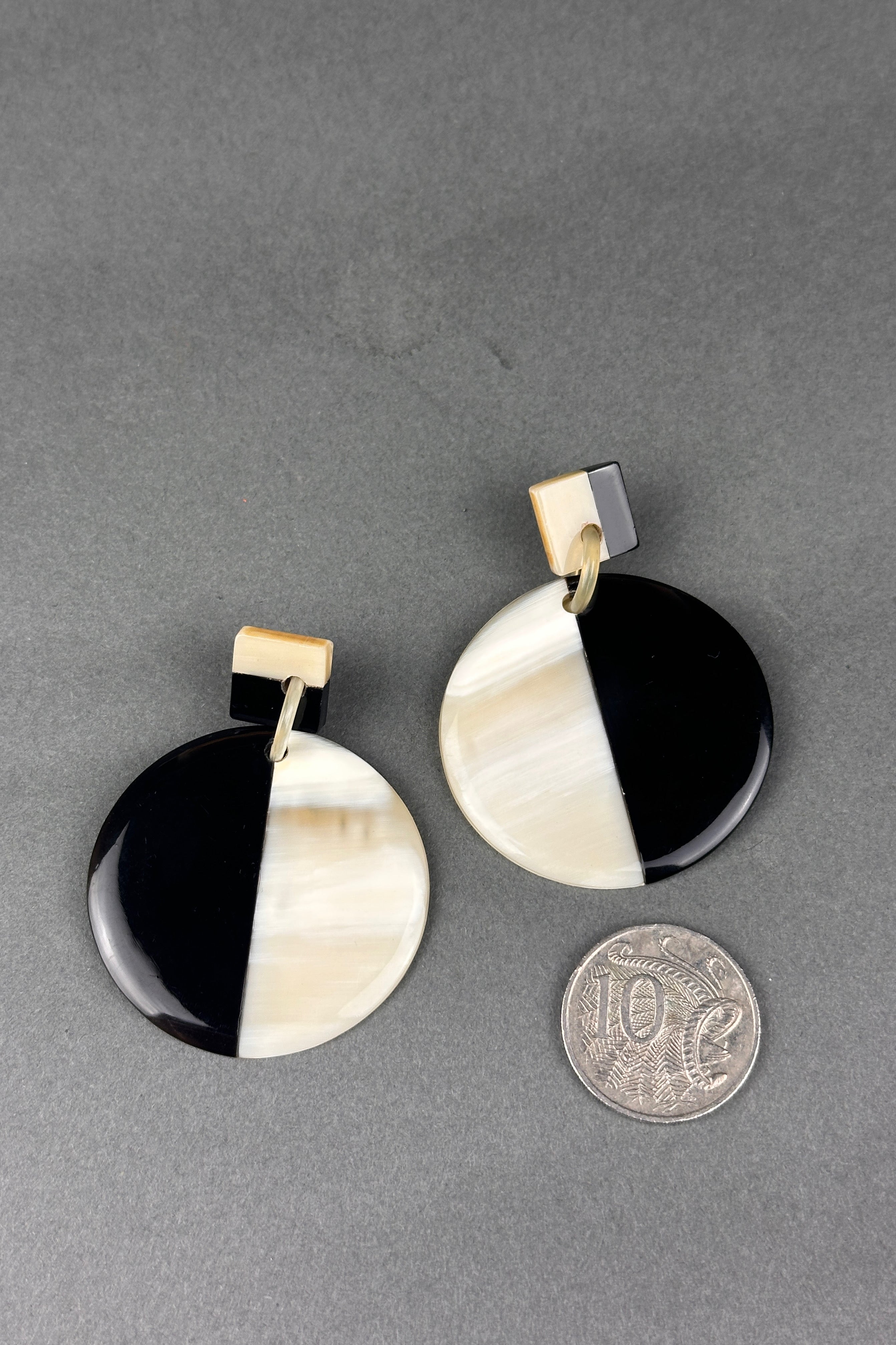 Soyang cream and black round horn earrings